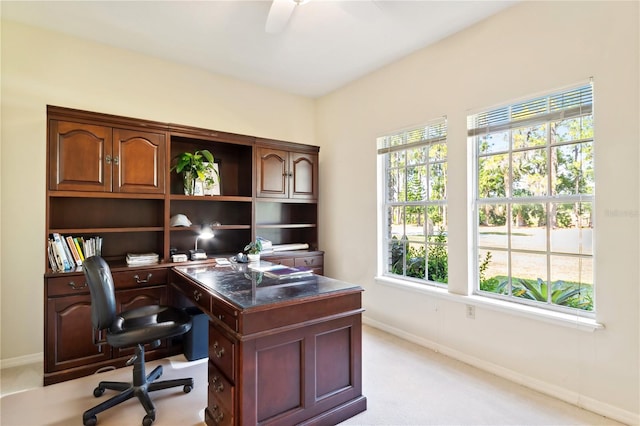 office area featuring ceiling fan and light carpet