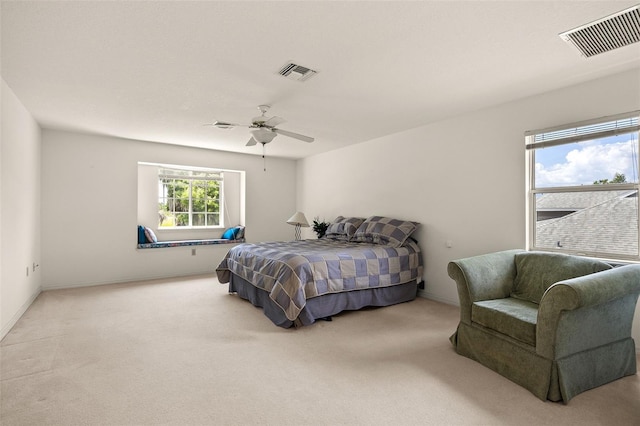 bedroom with ceiling fan and carpet floors