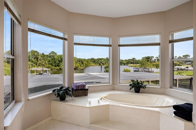 interior space with tile floors and a bath