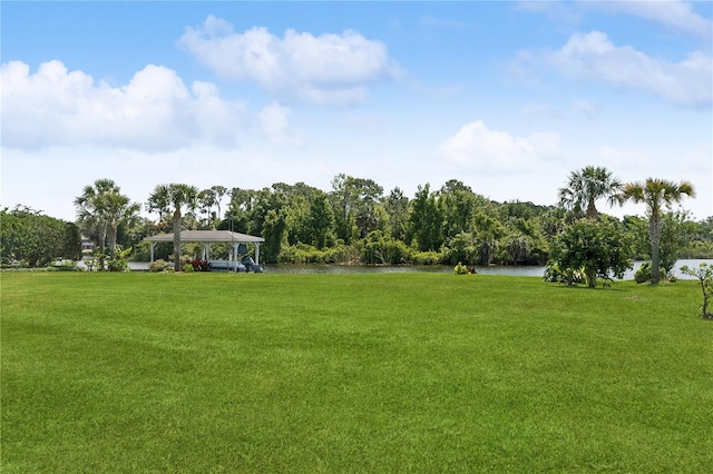 view of yard featuring a water view and a gazebo