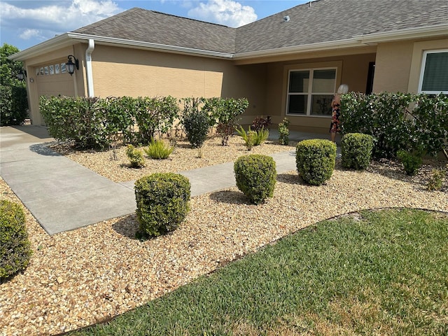 view of side of home featuring a garage