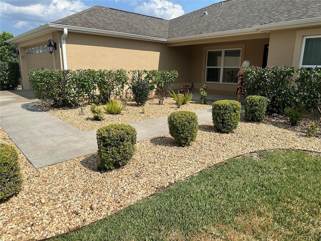 view of property exterior featuring a garage