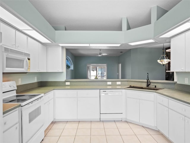 kitchen featuring ceiling fan, light tile patterned flooring, white appliances, a sink, and white cabinetry