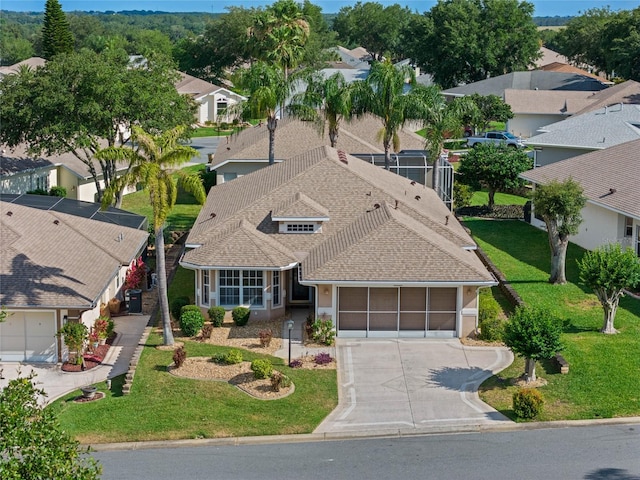 birds eye view of property with a residential view