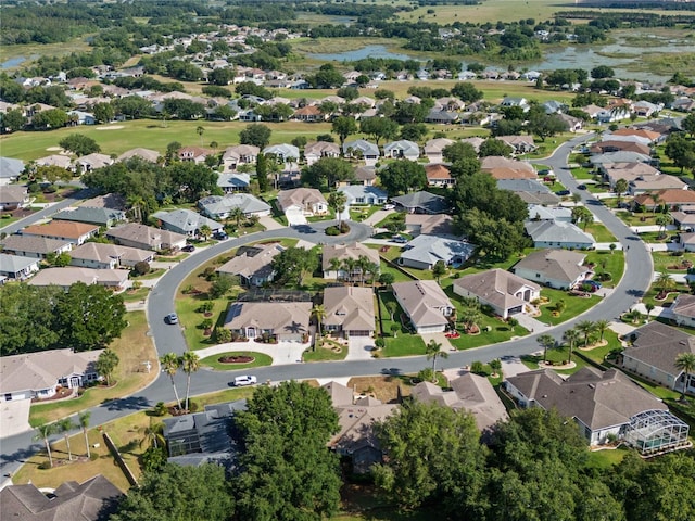 drone / aerial view with a water view and a residential view