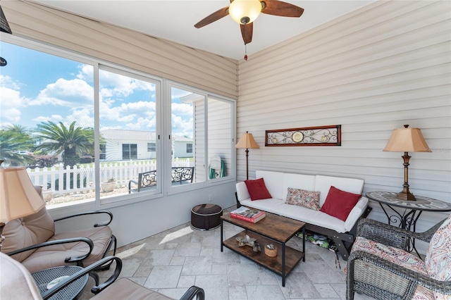 sunroom with ceiling fan