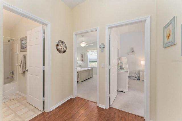 hallway featuring light wood-type flooring