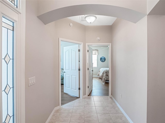 corridor with light hardwood / wood-style flooring