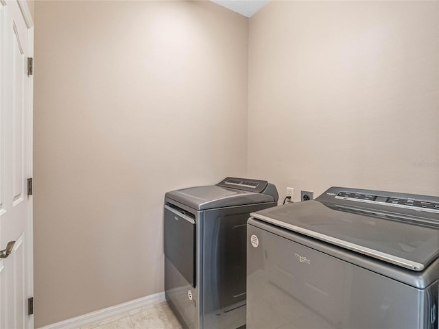 laundry area with washer and clothes dryer