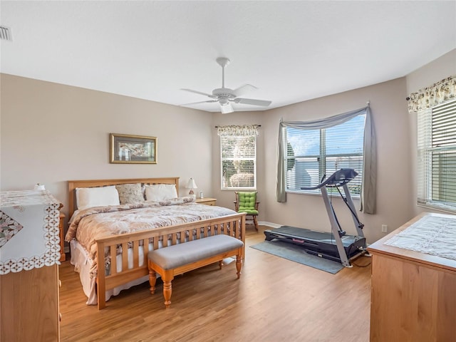 bedroom featuring light wood-type flooring and ceiling fan