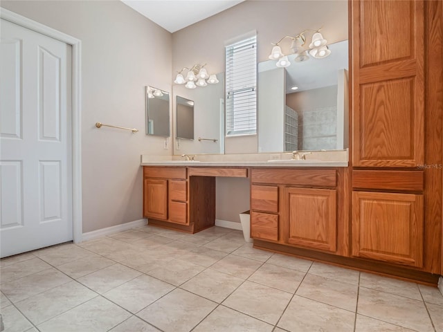 bathroom with tile patterned floors and vanity