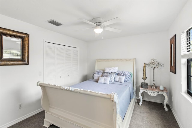 carpeted bedroom featuring a closet and ceiling fan