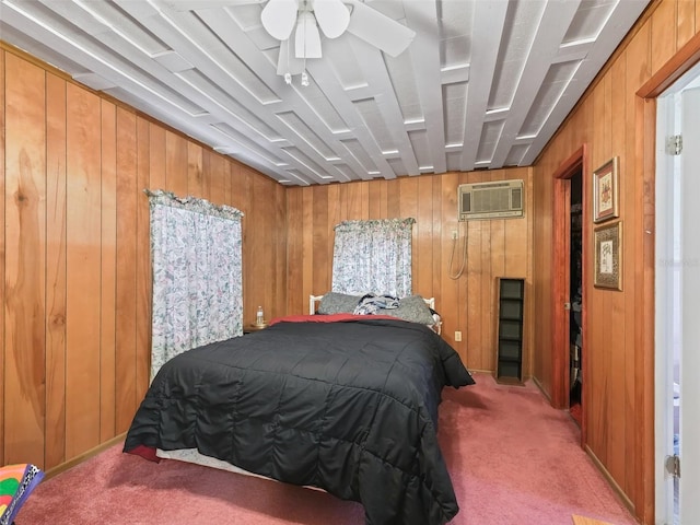 carpeted bedroom featuring wooden walls, ceiling fan, and a wall mounted air conditioner