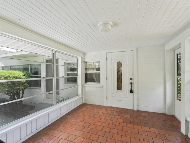 unfurnished sunroom featuring wooden ceiling