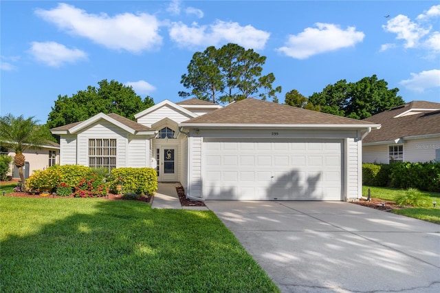 single story home featuring a garage and a front lawn