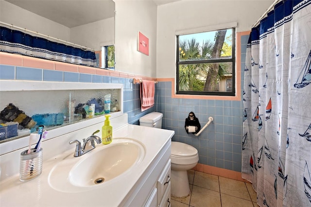 bathroom featuring tile walls, oversized vanity, toilet, tile flooring, and tasteful backsplash