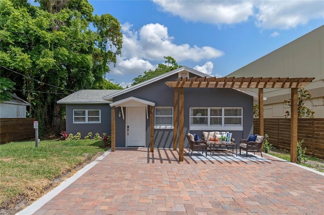 view of front facade featuring a patio and an outdoor living space