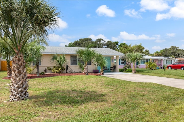 ranch-style house with a front lawn