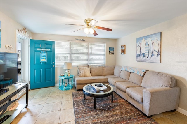 living room with light tile patterned floors and ceiling fan