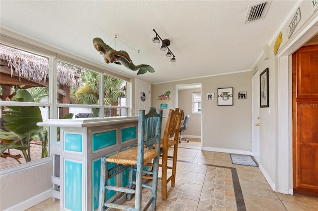 dining area featuring a textured ceiling