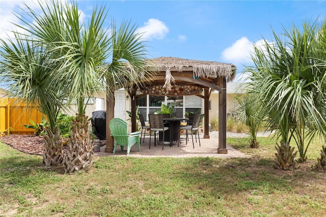 exterior space with a gazebo and grilling area