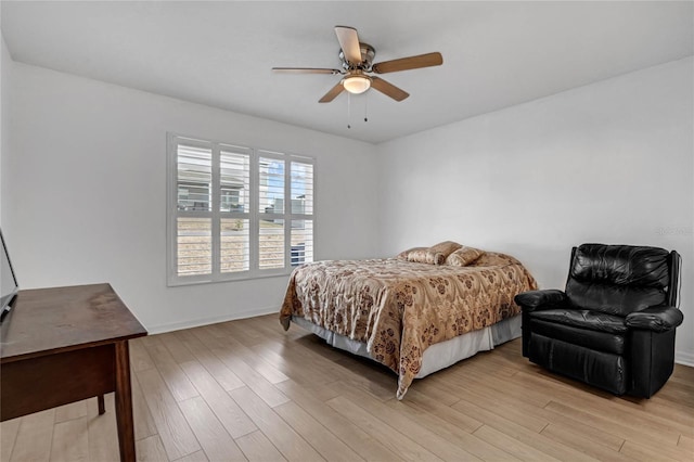 bedroom featuring light wood-type flooring and ceiling fan