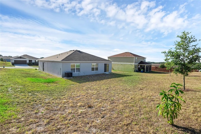 back of property with a lawn