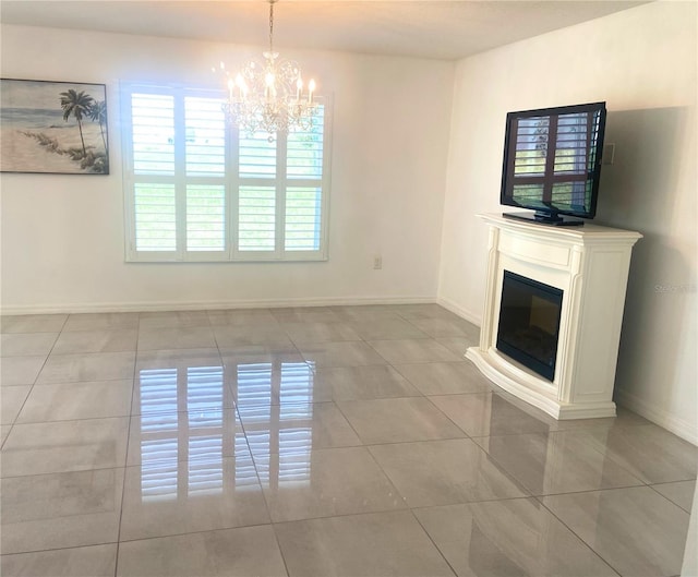 unfurnished living room featuring a notable chandelier and light tile patterned floors