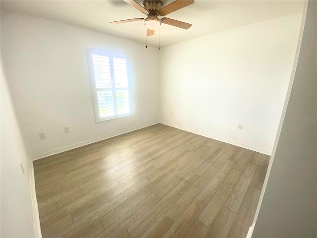 unfurnished room with wood-type flooring and ceiling fan