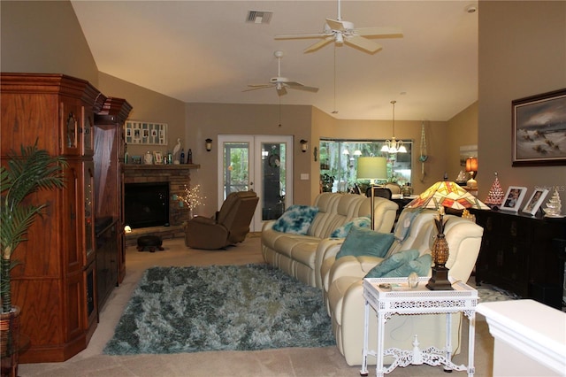 carpeted living room with high vaulted ceiling, ceiling fan, and french doors