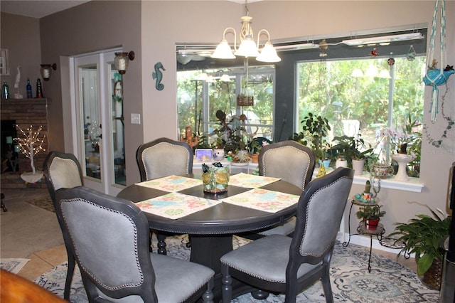 dining room with an inviting chandelier and tile floors