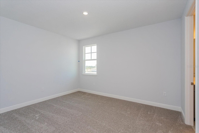 empty room with carpet flooring