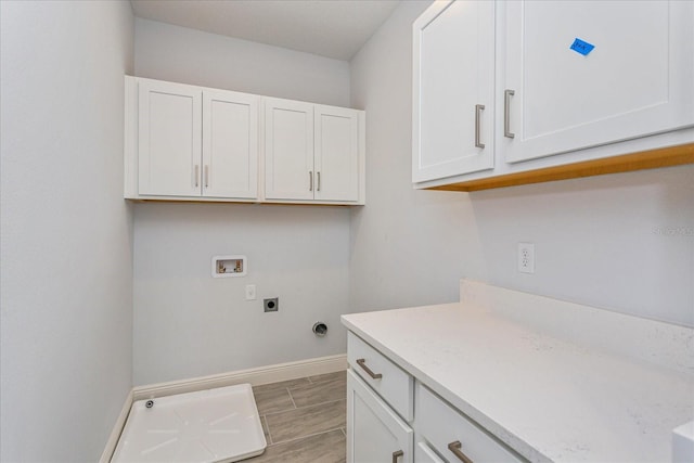 washroom with cabinets, washer hookup, and electric dryer hookup