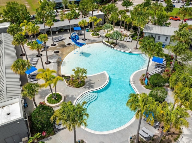 view of pool featuring a patio and a water slide