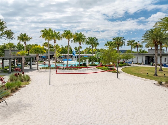 view of home's community featuring a pool and volleyball court