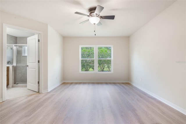 unfurnished room with ceiling fan and light wood-type flooring