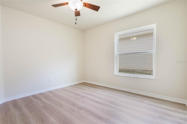 spare room with ceiling fan and light hardwood / wood-style floors