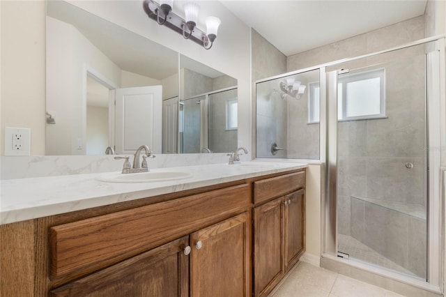 bathroom featuring double sink vanity, tile floors, and walk in shower