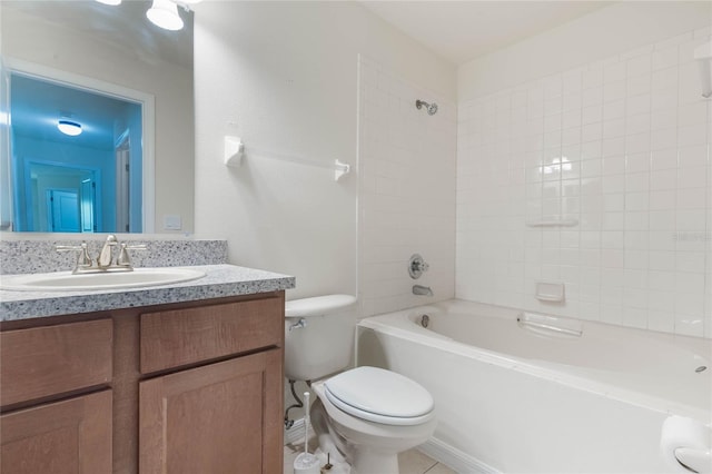 full bathroom featuring tile flooring, oversized vanity, tiled shower / bath combo, and toilet