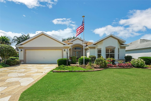 ranch-style home featuring a garage and a front lawn