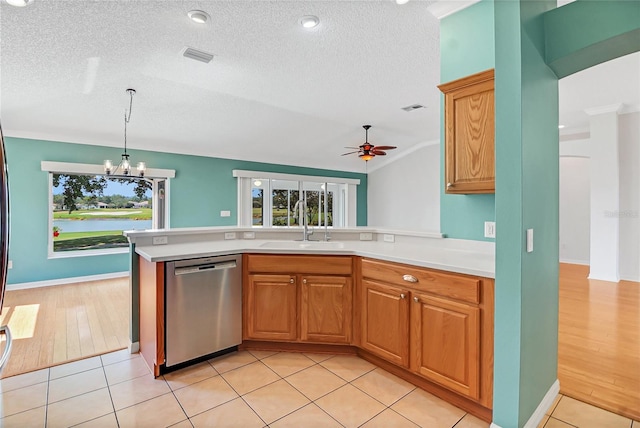 kitchen with stainless steel dishwasher, ceiling fan with notable chandelier, light wood-type flooring, and crown molding