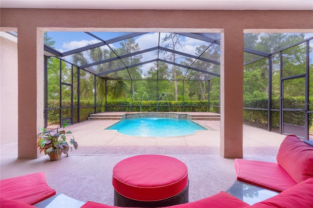 view of pool featuring a patio, a lanai, and pool water feature