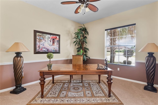 home office with ceiling fan and carpet floors