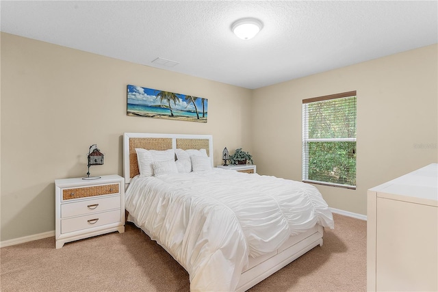 bedroom with light carpet