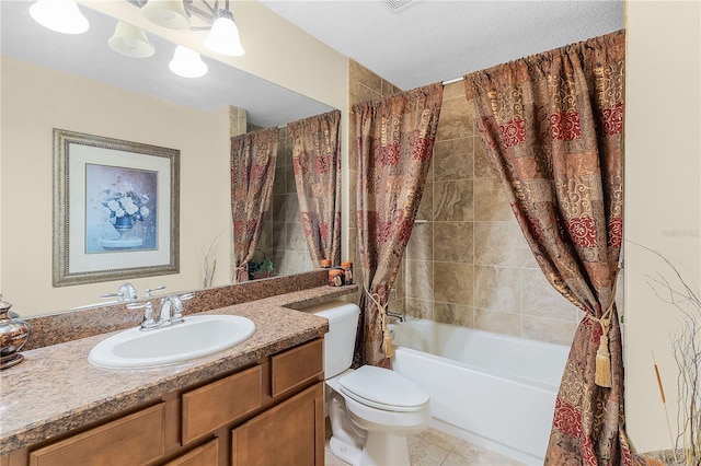 full bathroom with tile flooring, a textured ceiling, shower / tub combo with curtain, toilet, and vanity