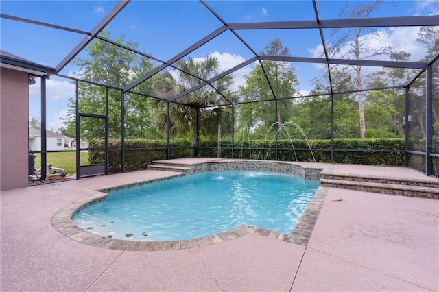 view of pool featuring a lanai, pool water feature, and a patio area