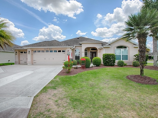 ranch-style home featuring a garage, a front lawn, concrete driveway, and stucco siding