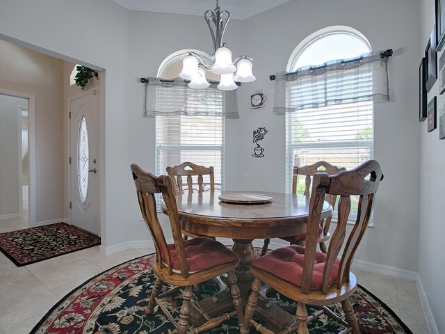 dining space with a healthy amount of sunlight, a notable chandelier, and light tile patterned floors