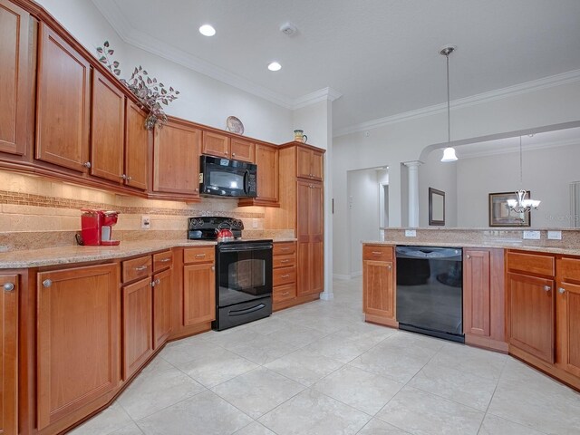 kitchen featuring black appliances, brown cabinetry, backsplash, and decorative light fixtures