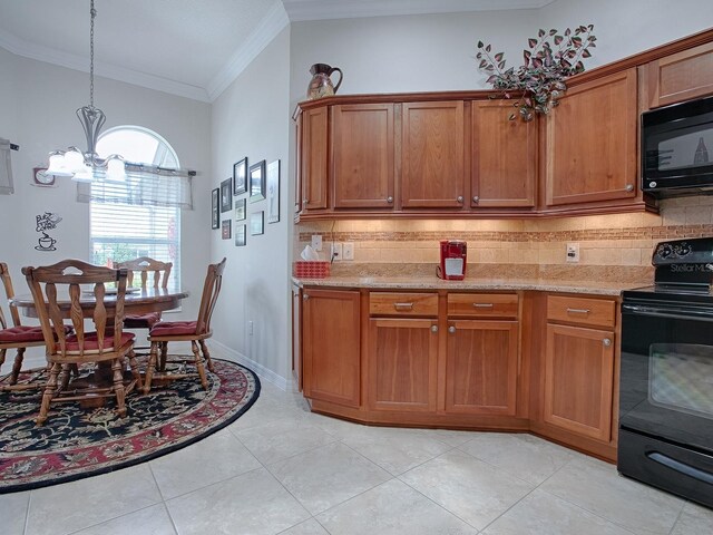 kitchen featuring a chandelier, ornamental molding, brown cabinets, black appliances, and tasteful backsplash